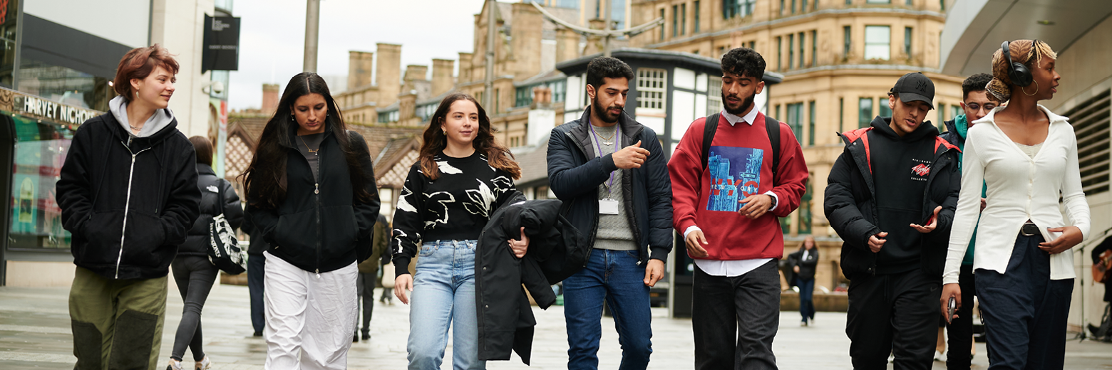 Students Walking Together In Manchester City Centre